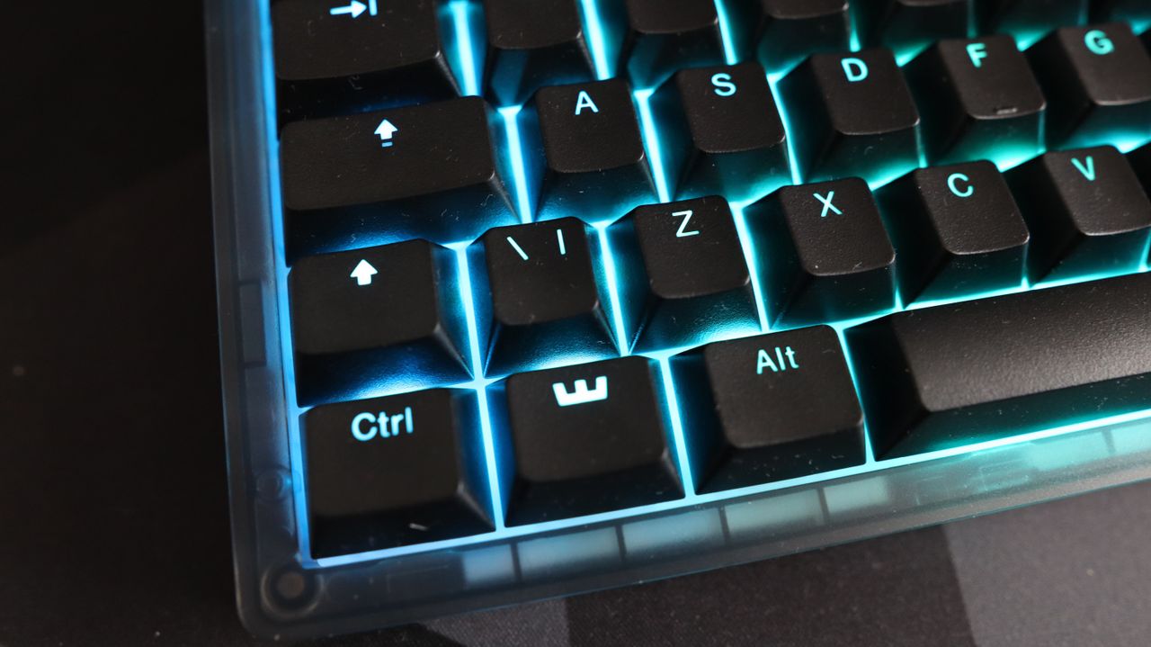 The Wooting 8-HE on a mouse pad with RGB lighting enabled.
