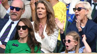 Catherine, Princess of Wales and Princess Charlotte of Wales cheer watching Carlos Alcaraz vs Novak Djokovic in the Wimbledon 2023 men's final on Centre Court during day fourteen of the Wimbledon Tennis Championships at the All England Lawn Tennis and Croquet Club on July 16, 2023 in London, England