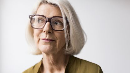 An older woman appears to be thinking about something important.