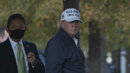 Donald Trump arrives back at the White House after playing golf on Saturday.