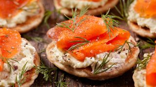 Smoked salmon on crackers with rosemary