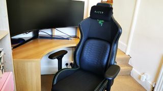 Razer Iskur gaming chair in black upholstery positioned at a desk