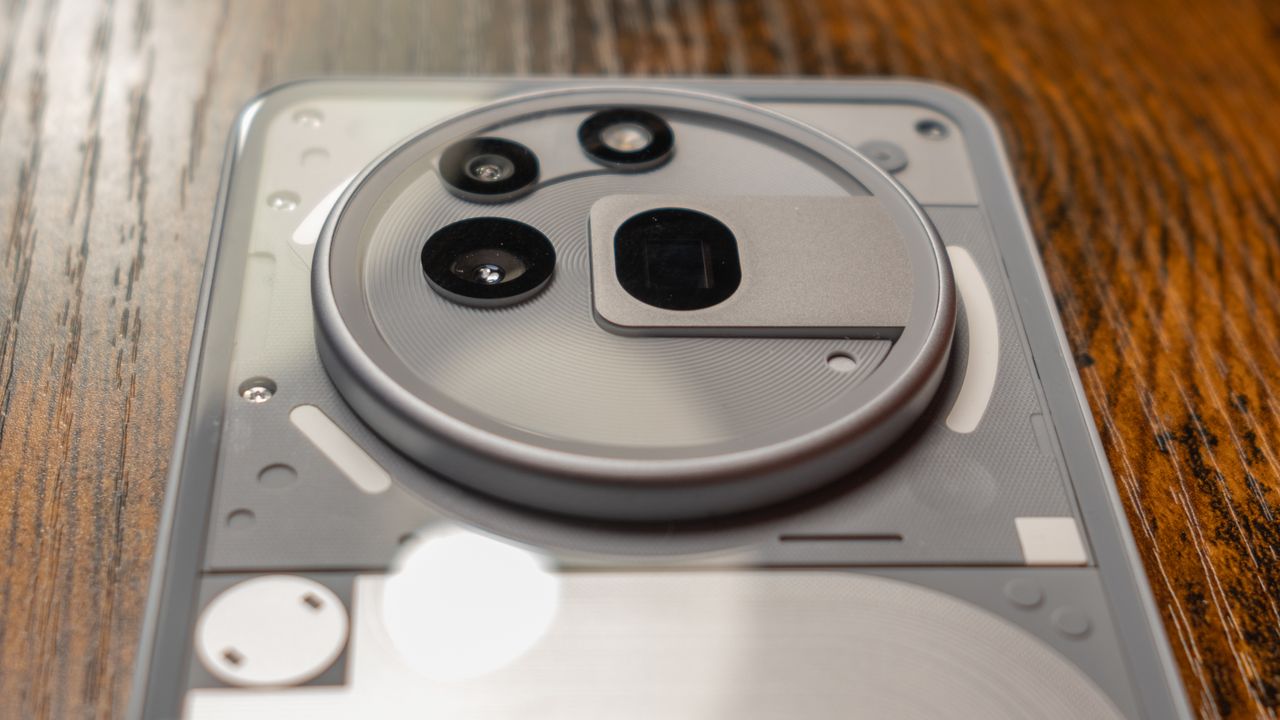 Nothing Phone 3a Pro back showing internals, camera bump, and USB-C port on bottom