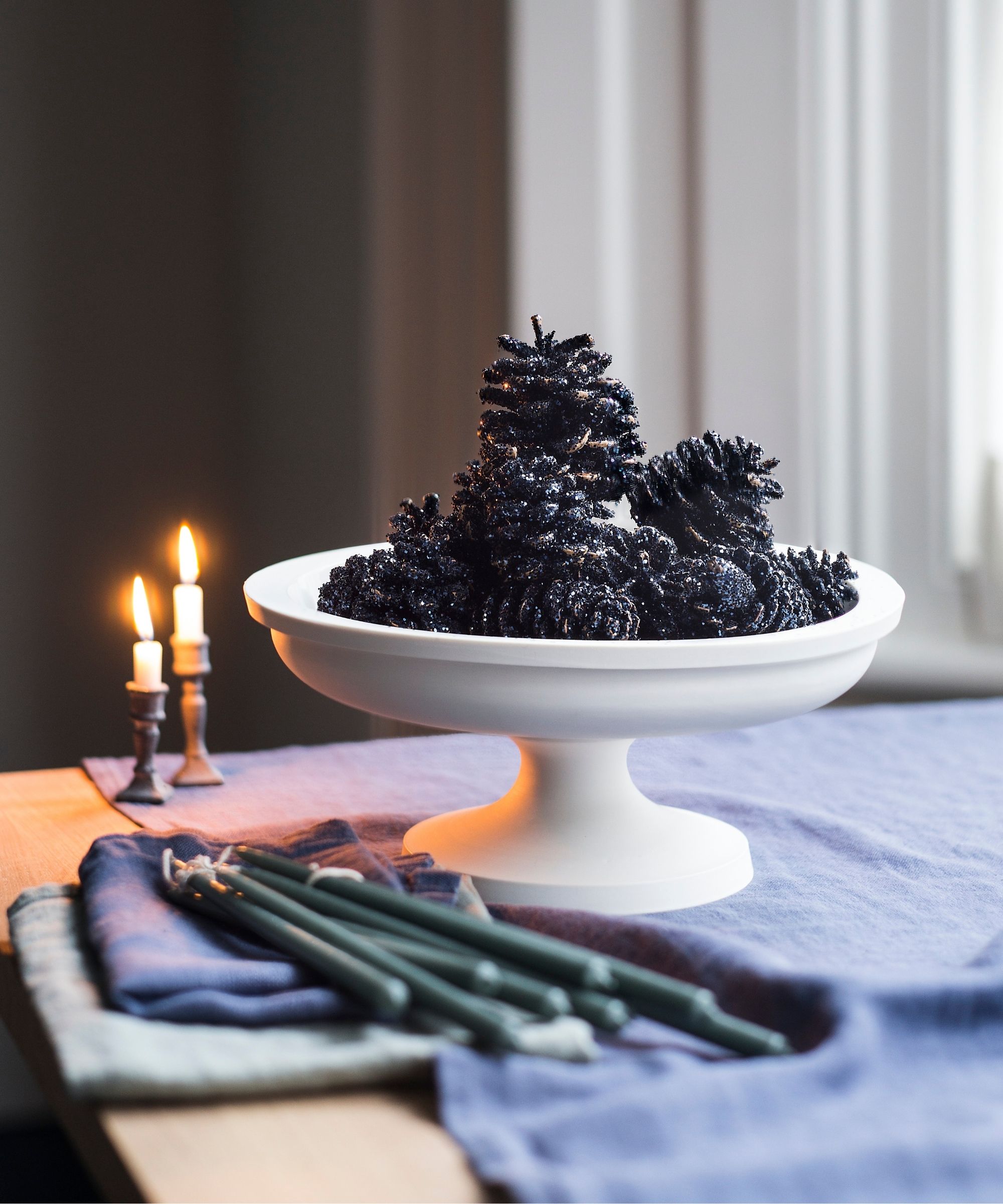 White bowl filled with pinecones