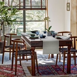 Dark wooden blinds in a Mid-century style dining room