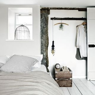 bedroom with white wall and cushion