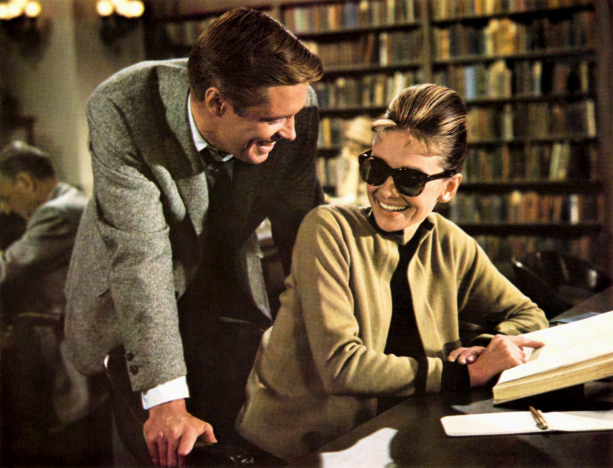 Audrey Hepburn as Holly Golightly reading a book