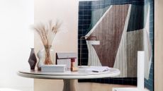 Deirdre Dyson carpet on wall with table in front with vases on