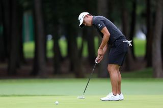 Collin Morikawa hits a putt