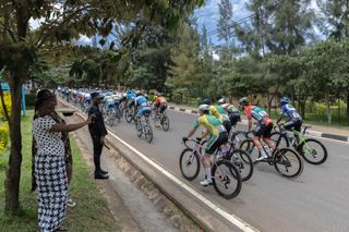 The pack rides during the last stage of the 16th Tour du Rwanda in Kigali on February 25, 2024. (Photo by Guillem Sartorio / AFP)