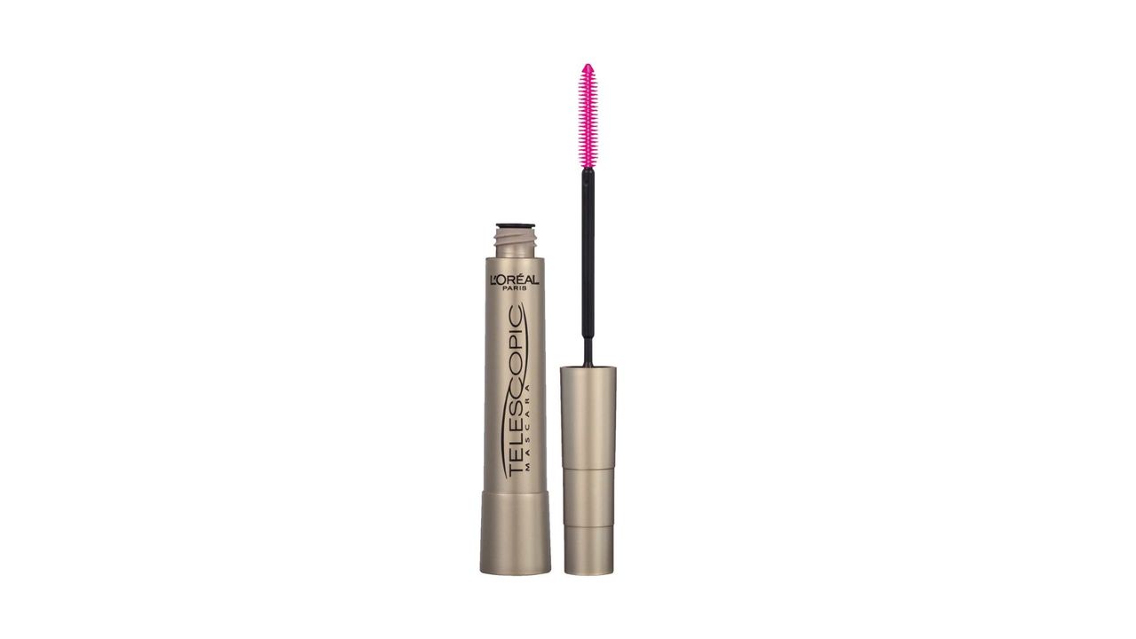 An opened thin gold L'Oreal mascara tube with a pink mascara brush for the best L'Oreal mascara.