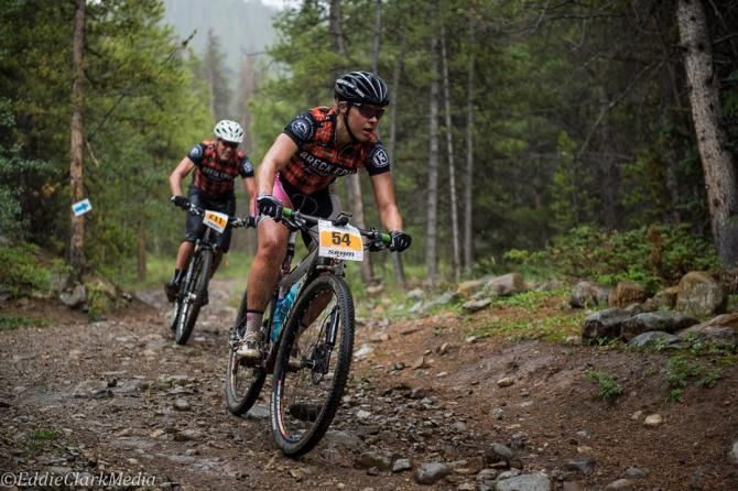 Breck Epic women's winner Amanda Carey (Stan's NoTubes) leads local open space planner and Clydesdale Scott Reid down Little French on stage 3. Both riders kitted out in race leader's jerseys.