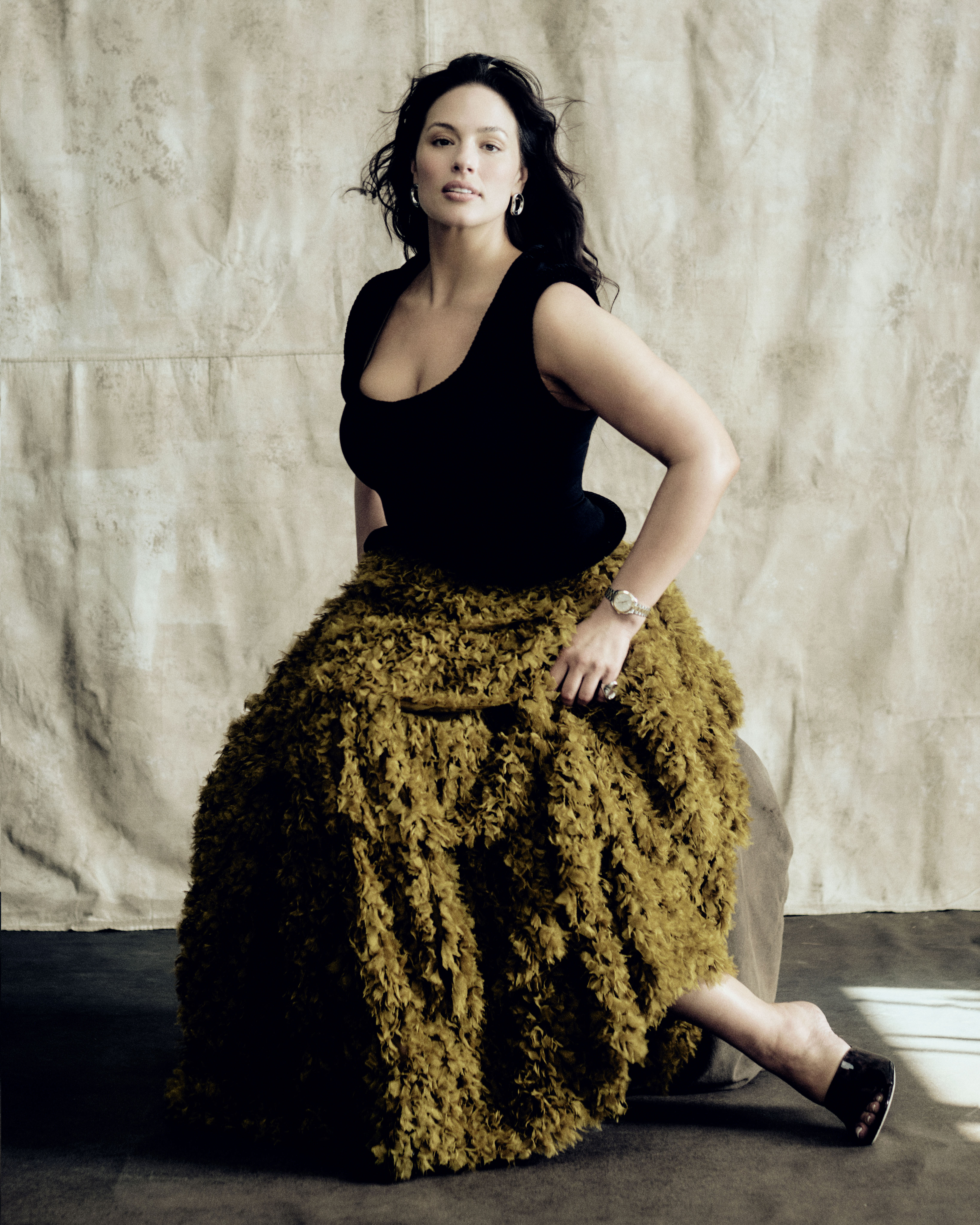 Ashley Graham poses in a textured green skirt for our latest cover shoot
