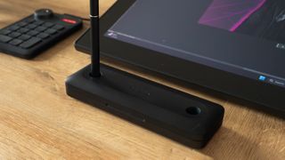 A Huion Kamvas Pro 27 drawing tablet in use on a desk