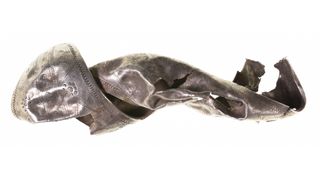 A twisted fragment of silver with ornamentation