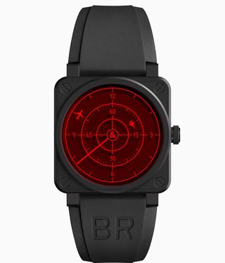 Black bell and ross watch with a red face with planes flying on it