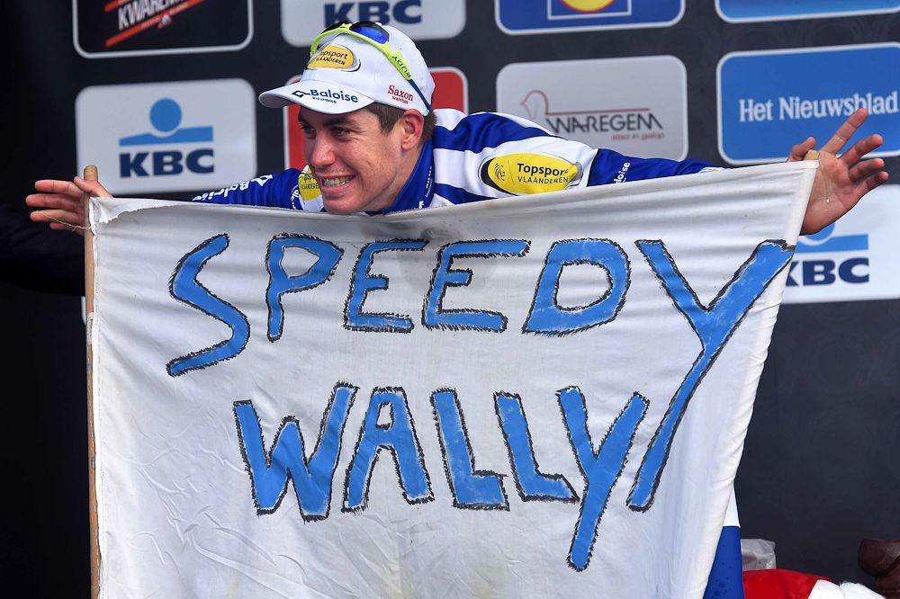 Wallays with a supporter's sign.
