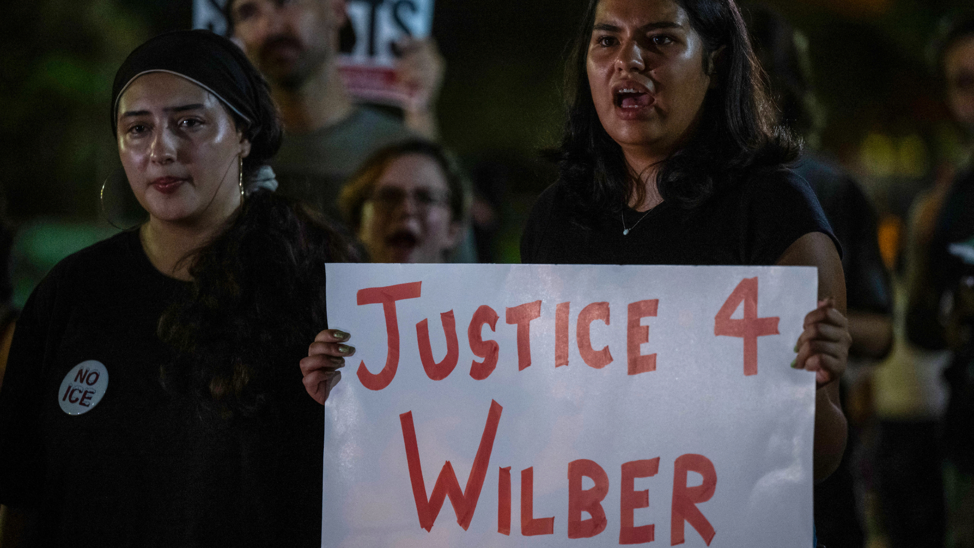People protest outside the Texas State Capitol in Austin, Texas, after a Venezuelan national was shot and wounded during a US Immigration and Customs Enforcement (ICE) operation.