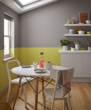 half painted yellow and grey kitchen