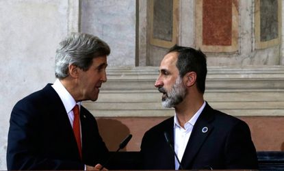 Secretary of State John Kerry shakes hands with Syrian National Coalition President Mouaz al-Khatib during a press conference on Feb. 28.