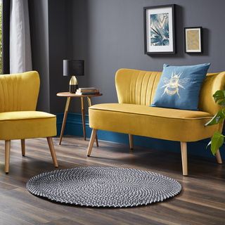 living room with yellow sofa and blue cushion