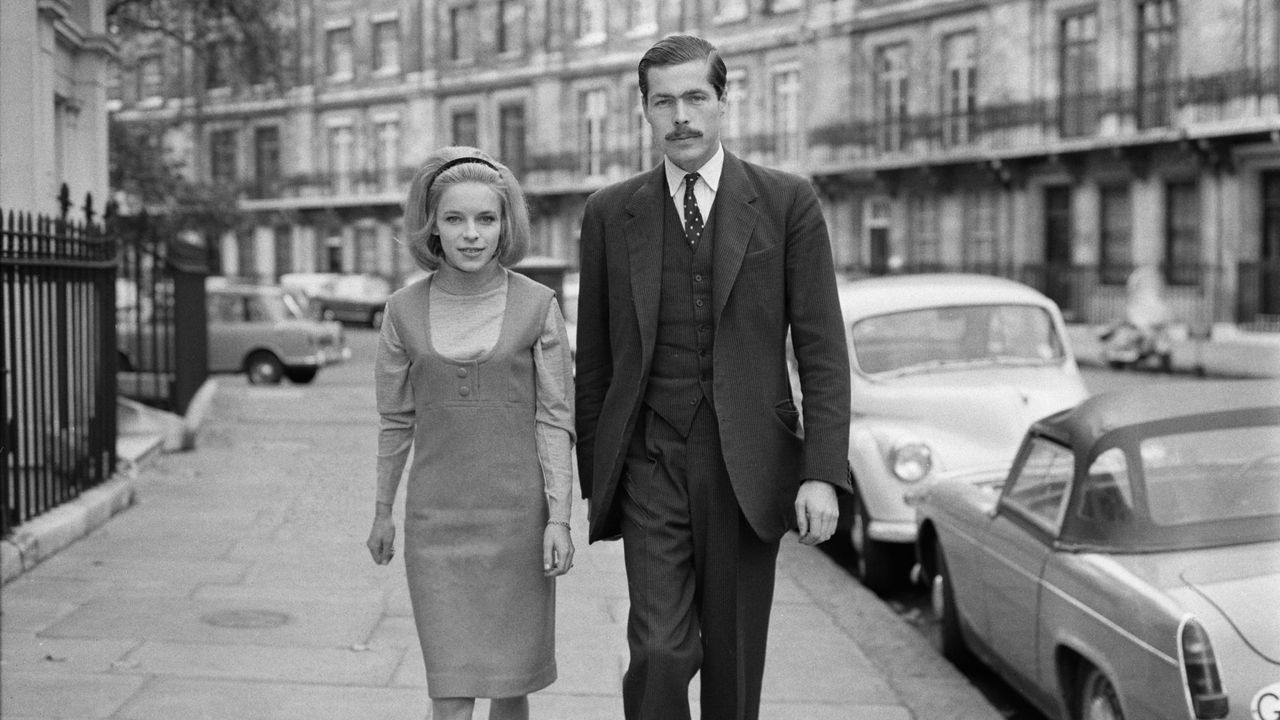 Black and white photo of Veronica Duncan (left) and John Bingham, the earl of Lucan, her future husband, pictured in 1963 on a London street