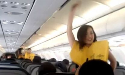 Flight attendants catch their passengers' attention with a choreographed safety presentation.
