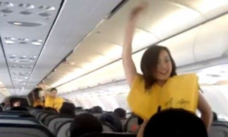 Flight attendants catch their passengers&amp;#039; attention with a choreographed safety presentation.