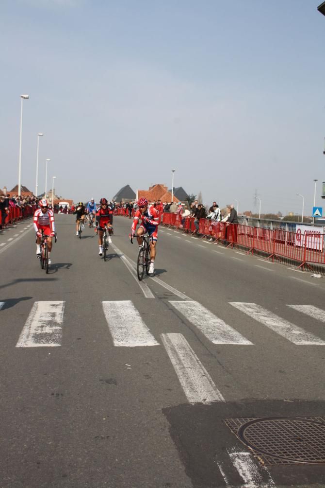 Thor Hishovd radios back to his team as he rides to sign on