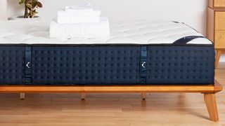 A close-up showing the handles on the side of the Helix Midnight hybrid mattress