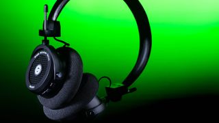 Grado GW100x open-back headphones on green background 