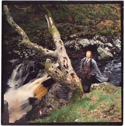 Man standing in nature with formal attire
