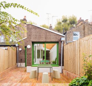 Rear extension with cork walls and green window frames