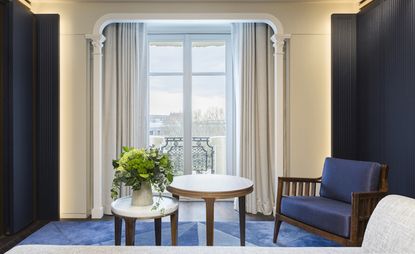 Guestroom at Lutetia hotel, Paris, France with blue interior and Juliette balcony 