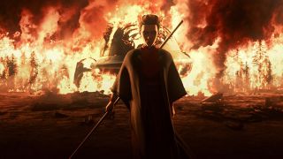 a character in a dark robe walks away from a fire holding a laser sword