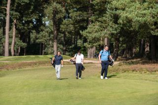 golfers walking