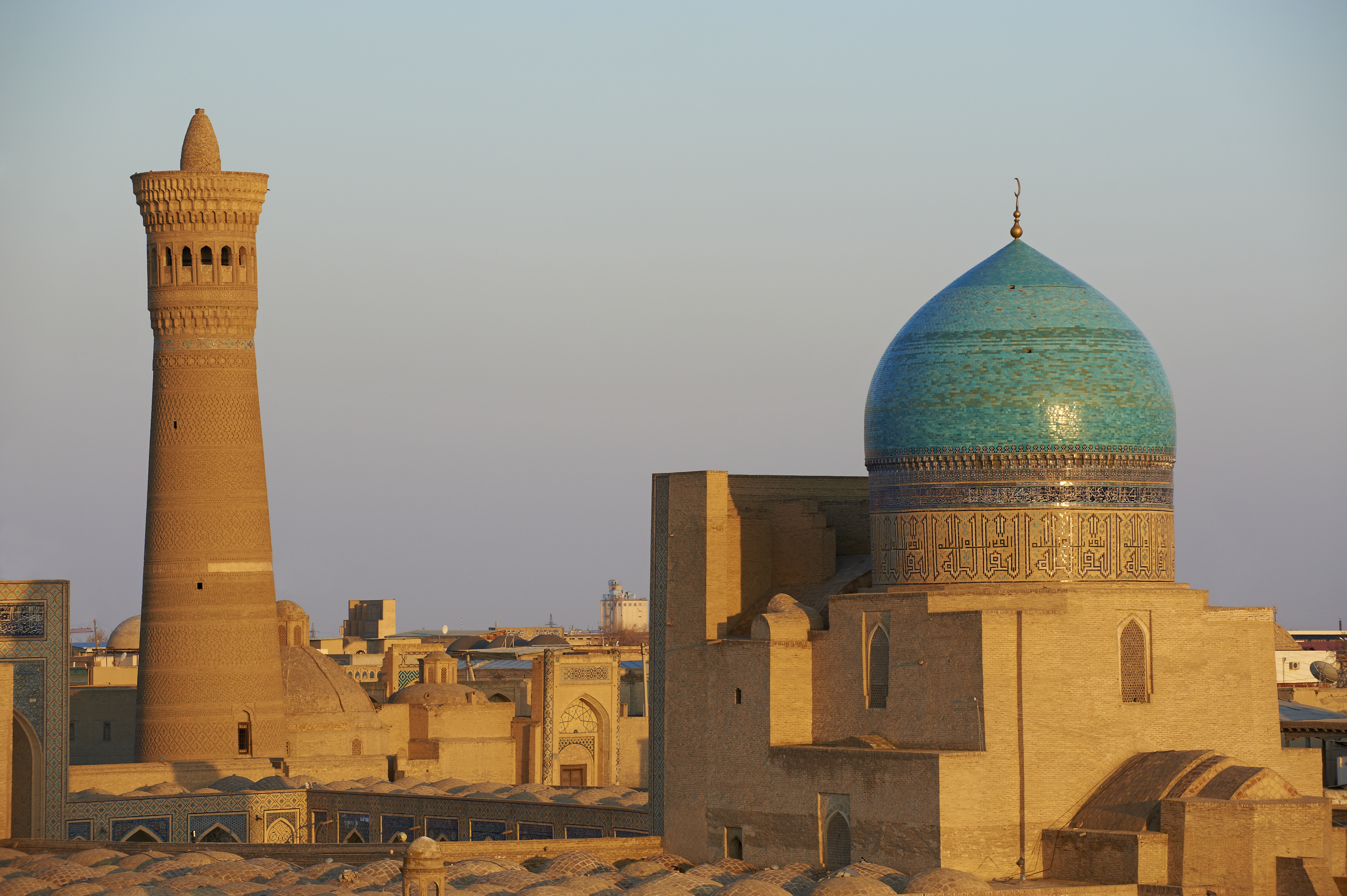 The 900-year-old Kalon Minaret, flanked by the Great Mosque and Mir-i-Arab madrasa, towers above the Uzbekistan city of Bukhara