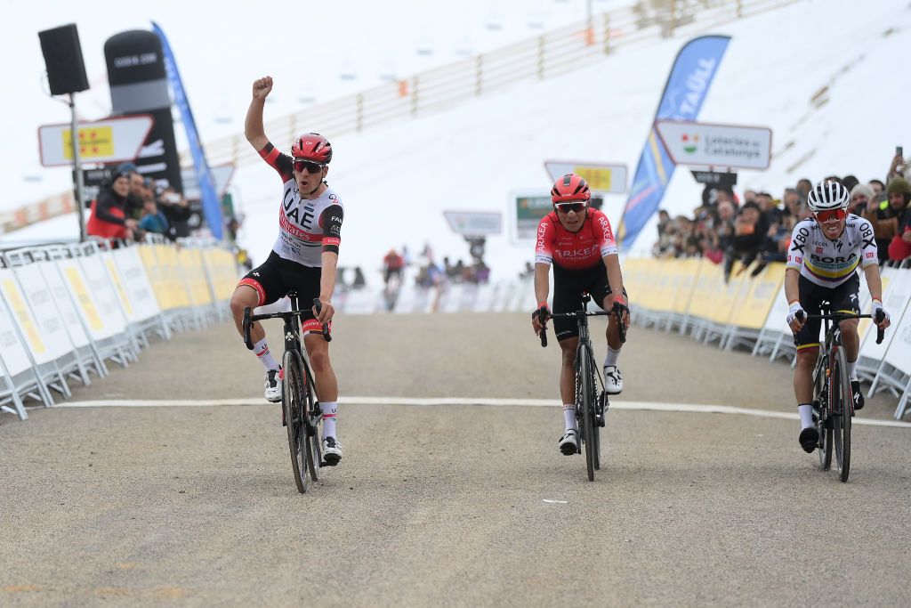 BO TALL SPAIN MARCH 24 lJoo Almeida of Portugal and UAE Team Emirates celebrates at finish line as stage winner ahead of Nairo Alexander Quintana Rojas of Colombia and Team Arka Samsic and Sergio Andres Higuita Garcia of Colombia and Team Bora Hansgrohe during the 101st Volta Ciclista a Catalunya 2022 Stage 4 a 1665km stage from La Seu dUrgell to Bo Tall 2015m VoltaCatalunya101 WorldTour on March 24 2022 in Bo Tall Spain Photo by David RamosGetty Images