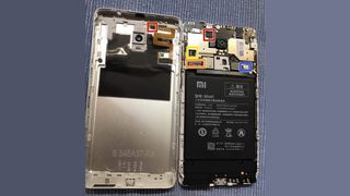 Inside a Redmi Note 4 phone, battery now visible