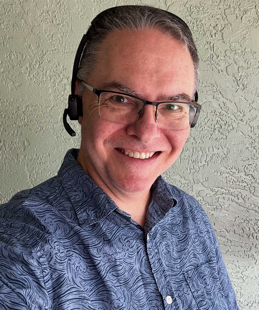 Mark J. Pescatore wearing Shokz OpenMeet 2 UC