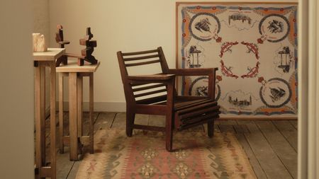 A former warehouse, now converted into a beautifully designed and decorated factory filled with mid-century modern and period wooden furniture, pops of colors, intricate fabrics, and lots of sunshine.