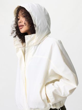 Uniqlo model wearing cream funnel jacket