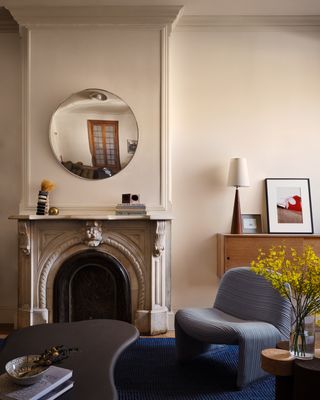 living space with historic fireplace at Bed-Stuy Townhouse