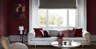 plum painted living room with neutral furniture to highlight a key interior paint colour trend 2024