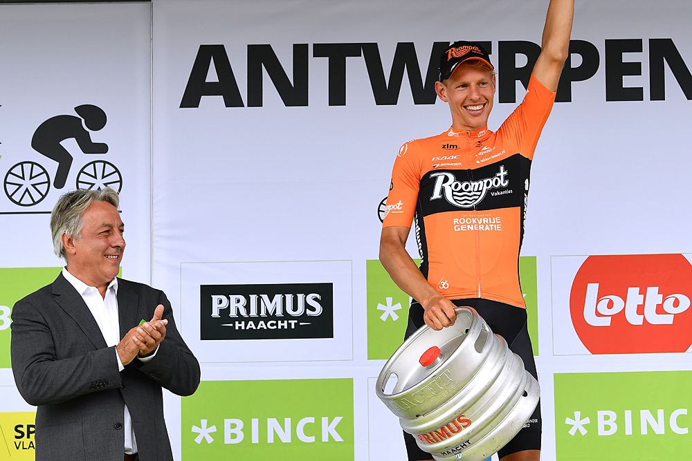 Taco van der Hoorn (Roompot-Nederlandse Loterij) on the podium after winning stage 3 at the BinckBank Tour