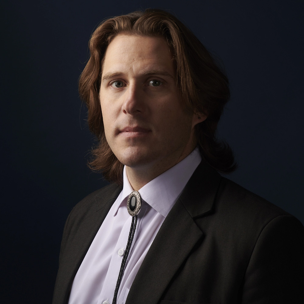 Brett Tingley against a dark background