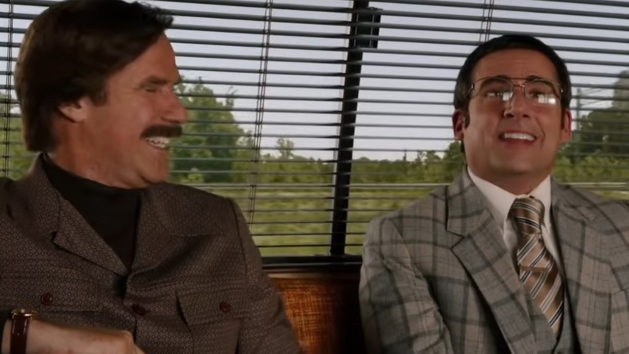 Will Ferrell laughing with Steve Carell in Anchorman 2: The Legend Continues
