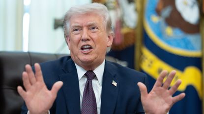 Donald Trump gesticulating in the Oval Office