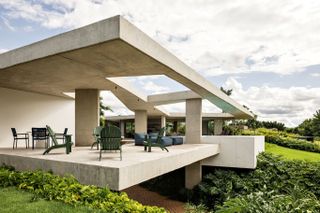 Casa Subtração outdoor seating area on a ledge