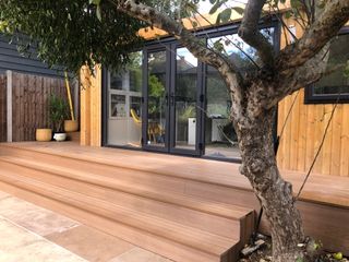 A home office in a garden with integrated decking steps